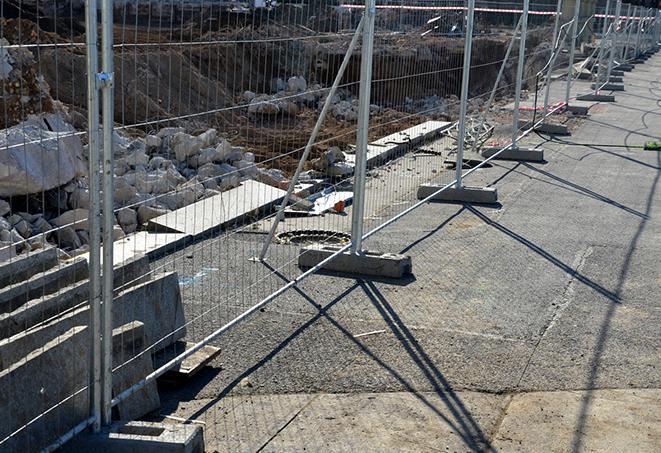 temporary fence panels used for perimeter security at a sports event